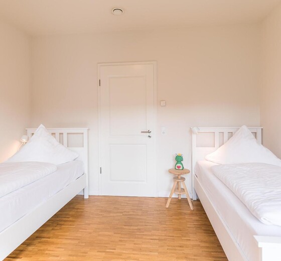 Schlafzimmer mit 2 Betten-Bi de Kark - Ferienhaus / Ferienwohnung Büsum -  17