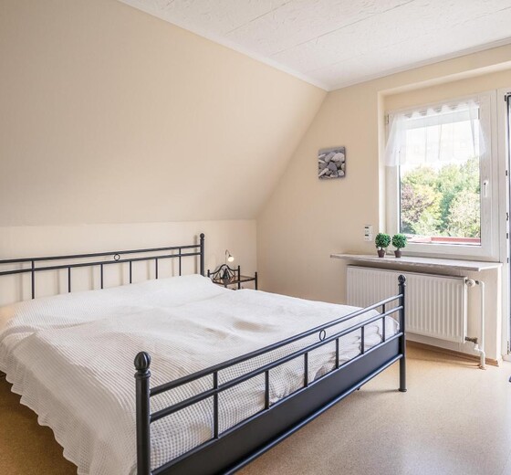 Schlafzimmer mit Bett-Appartement Svea - Ferienhaus / Ferienwohnung Büsum -  9