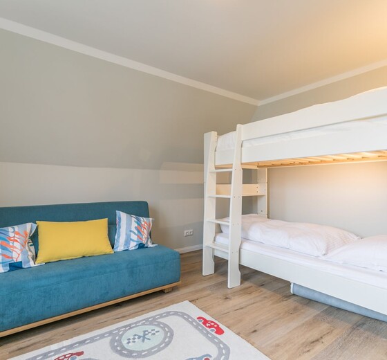 Schlafzimmer 2 mit Etagenbett und Schlafsofa-Wellenhus - Ferienhaus / Ferienwohnung Büsum -  17