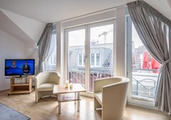 Wohnzimmer mit TV und Sitzgelgenheit-Haus Kattegat, Whg. 1 - Ferienhaus / Ferienwohnung Büsum - 3