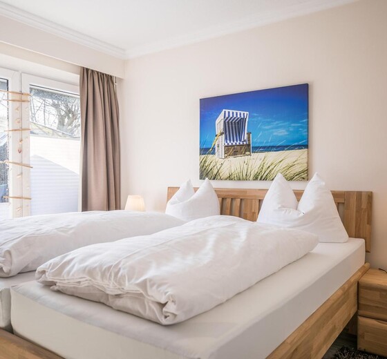 Schlafzimmer mit Bett-Appartementhaus Meeresbucht Whg. 1 - Ferienhaus / Ferienwohnung Büsum -  9