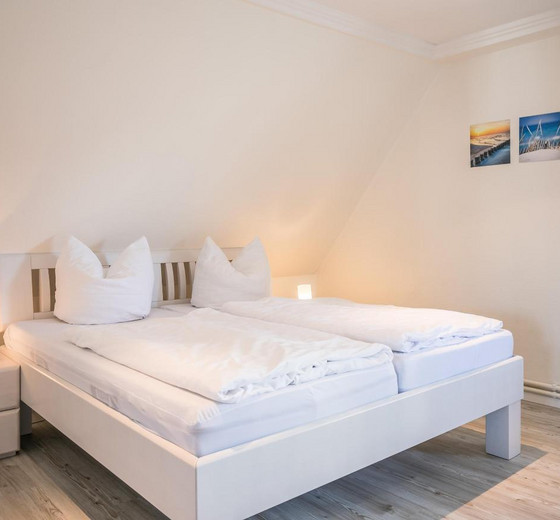 Schlafzimmer mit Bett-Appartementhaus Meeresbucht Whg. 11 - Ferienhaus / Ferienwohnung Büsum -  7