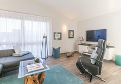 Wohnbereich mit Relaxsessel-Wohnung Admiral, Penthouse-Wohnung- Ferienhaus / Ferienwohnung Büsum - 4