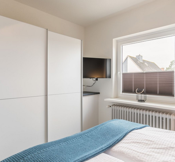 Schlafzimmer mit Doppelbett-deichlodge, lodge.drei - Ferienhaus / Ferienwohnung Büsum -  8