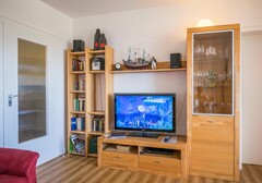 Wohnzimmer mit TV-Appartement im Hochhaus - Ferienhaus / Ferienwohnung Büsum - 5