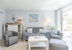 Wohnzimmer mit Sofa uns Sesseln-Wohnung Möwennest- Ferienhaus / Ferienwohnung Büsum - 4