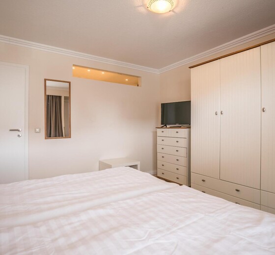 Schlafzimmer mit Bett-Appartementhaus Meeresbucht Whg. 4 - Ferienhaus / Ferienwohnung Büsum -  11